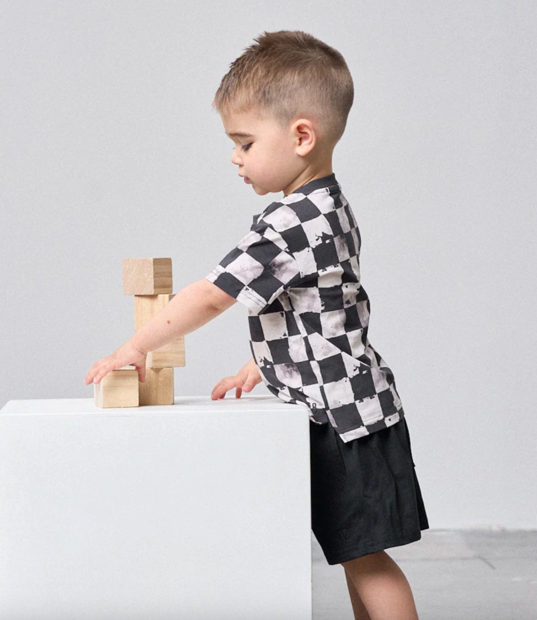 little boys all over checkered tee black