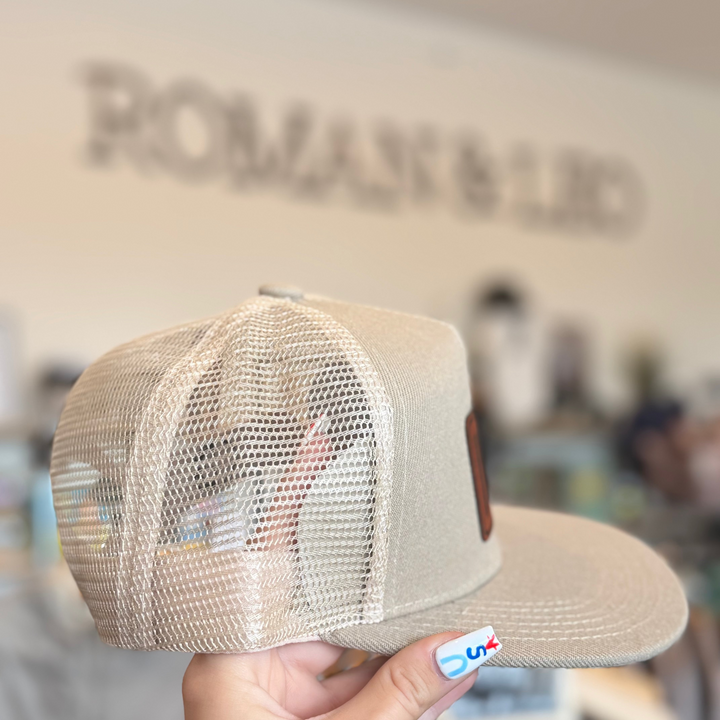trucker hat in sand