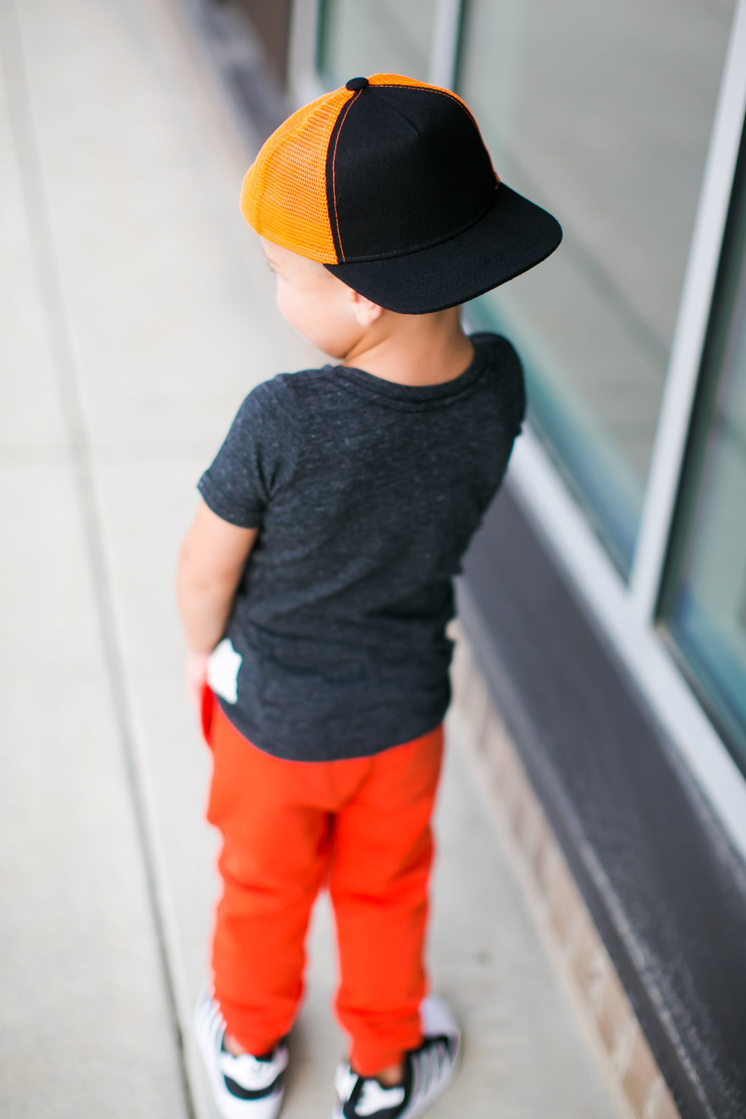 baby and kids Orange and black trucker hat 