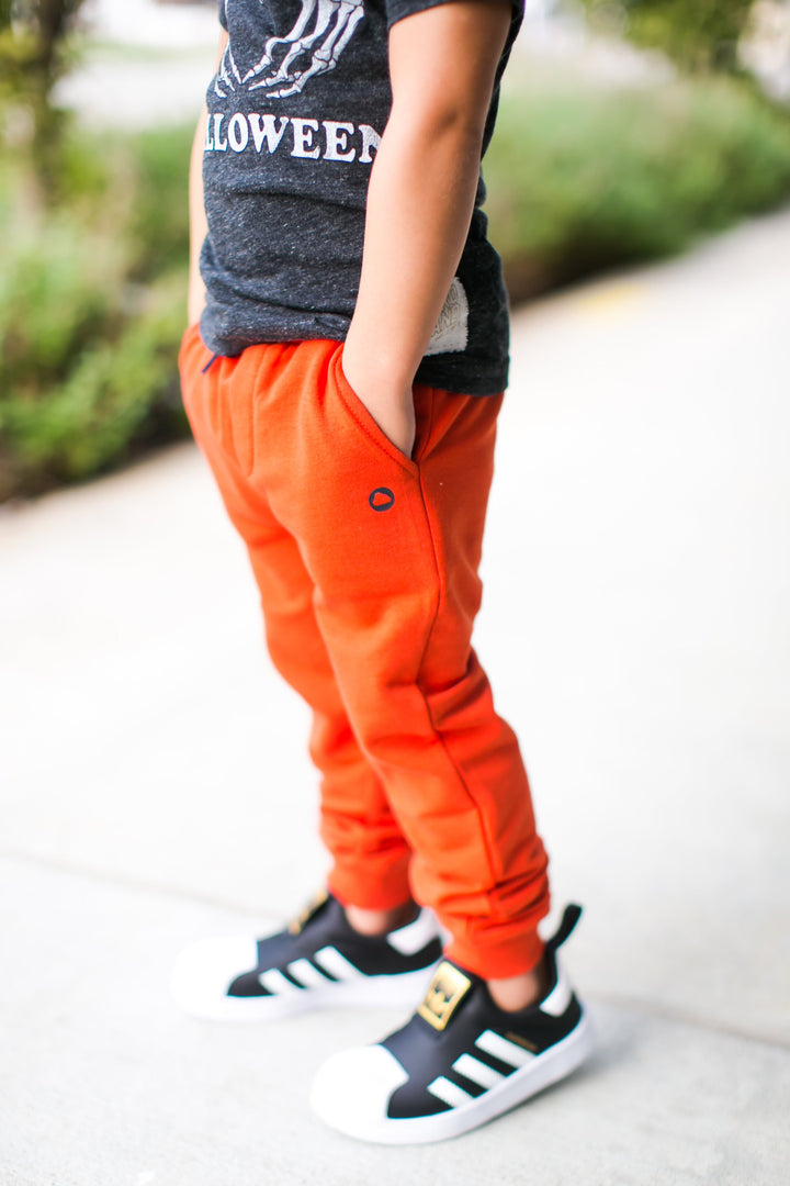 boys orange joggers