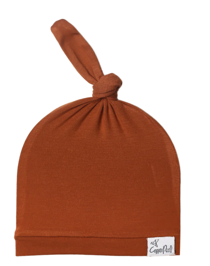 Copper Pearl rust topknot hat
